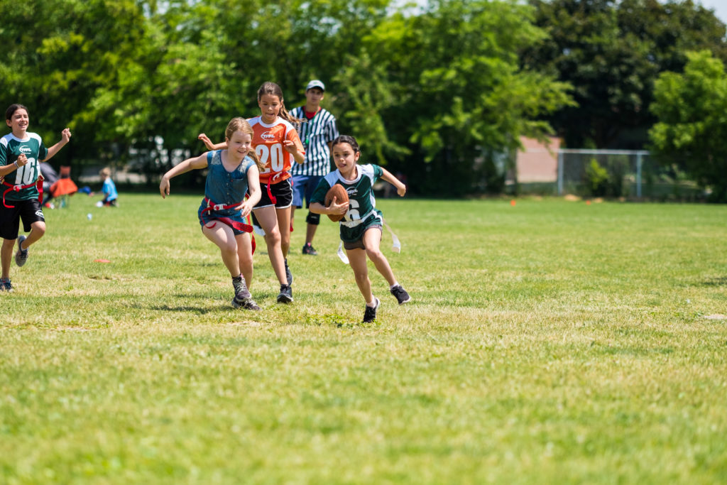 Girl turns the corner and is going to score a touchdown!